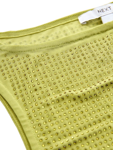Top de la Next pe verde