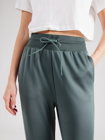 NIKE Tapered Sports trousers 'ONE' in Green
