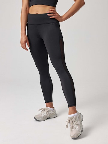 SNOCKS Skinny Sportbroek in Zwart: voorkant