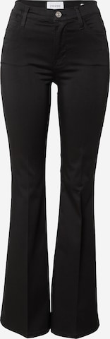 FRAME Flared Trousers in Black: front