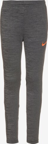 NIKE Skinny Workout Pants in Grey: front