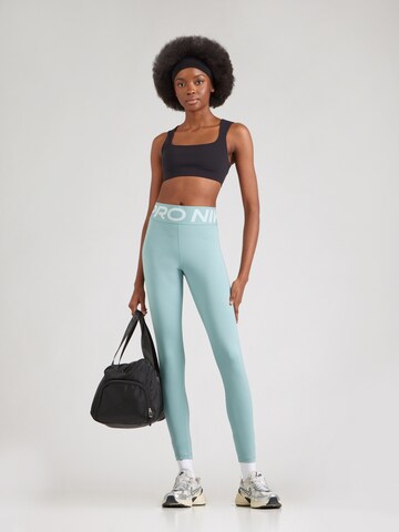 NIKE Skinny Sportbroek in Groen