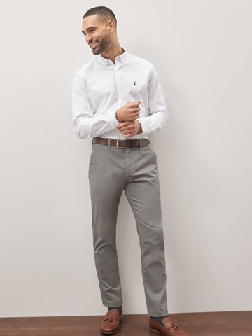 Slimfit Pantaloni chino di Next in grigio