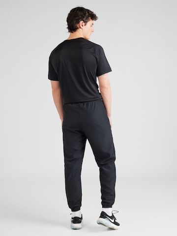 NIKE Tapered Workout Pants 'Academy' in Black
