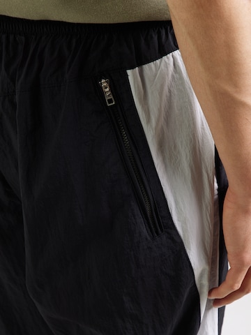 Nike Sportswear Ohlapna forma Hlače 'AIR' | črna barva