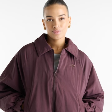 new balance - Chaqueta de entretiempo 'Woven Bomber Jacket' en marrón
