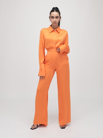 ABOUT YOU x VIAM Studio Loose fit Trousers 'ELVIS' in Orange: front