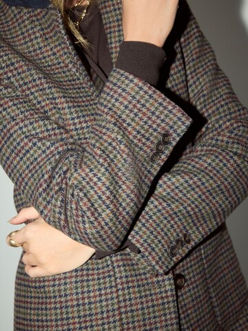 Sacou de la Next pe maro