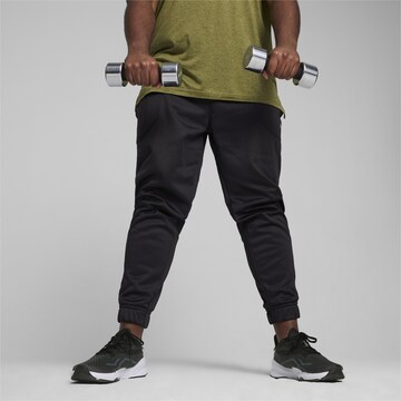 PUMA Tapered Sportbroek in Zwart