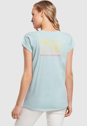 T-shirt 'Spring - Grow through' Merchcode en bleu