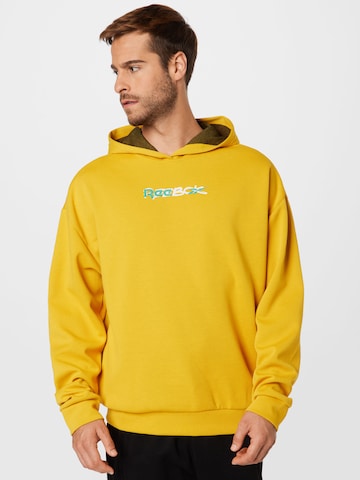 Reebok Athletic Sweatshirt in Yellow: front