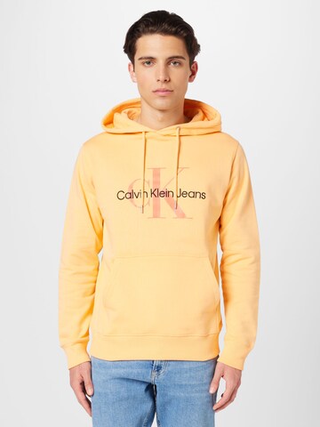 Calvin Klein Jeans - Sweatshirt 'Essentials' em laranja: frente