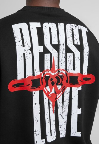 Karl Kani Sweatshirt 'Woven Signature Resist Love Crew' in Zwart