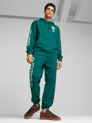 PUMA Bluzka sportowa 'PUMA X STAPLE' w kolorze zielony