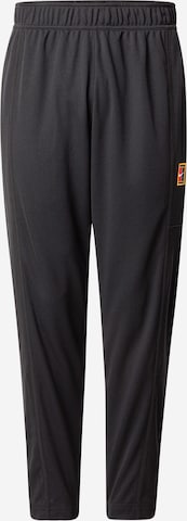 NIKE Tapered Sports trousers 'HERITAGE' in Black: front