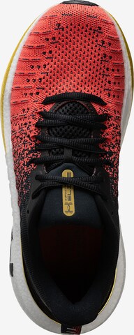 Chaussure de course UNDER ARMOUR en rouge