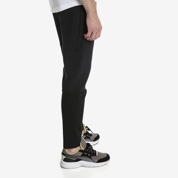 PUMA Tapered Sporthose 'Evostripe Move' in Schwarz