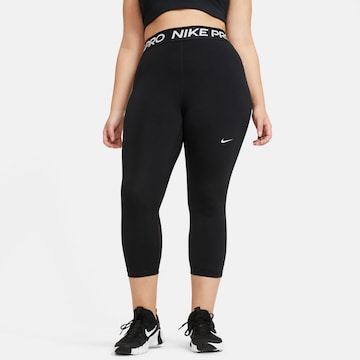 Skinny Pantaloni sportivi di NIKE in nero