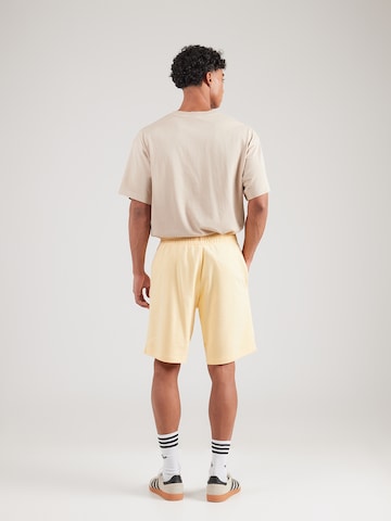 geltona ADIDAS ORIGINALS Standartinis Kelnės 'Essentials'