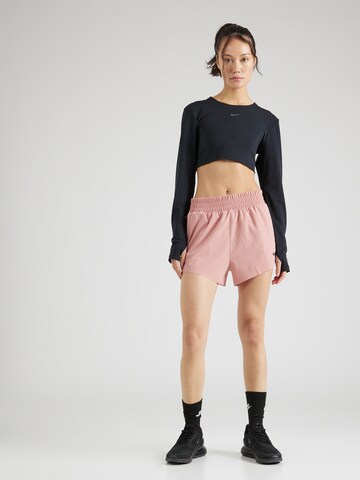 regular Pantaloni sportivi 'Run Division' di NIKE in rosso
