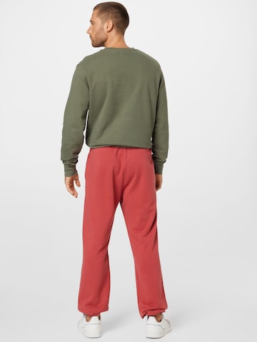 LEVI'S ® Zúžený Kalhoty 'Levi's® Unisex Fleece Jogger' – červená