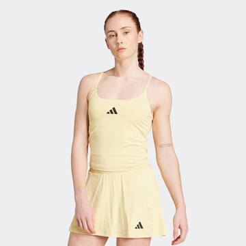 Top sportivo 'OPTIME' di ADIDAS PERFORMANCE in giallo: frontale