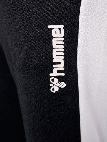 Effilé Pantalon de sport Hummel en noir