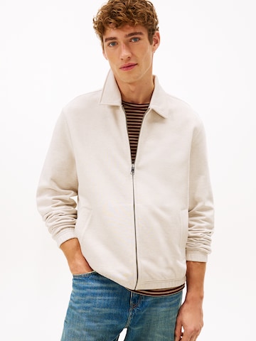 TOMMY HILFIGER - Sudadera con cremallera 'ESSENTIAL' en beige: frente