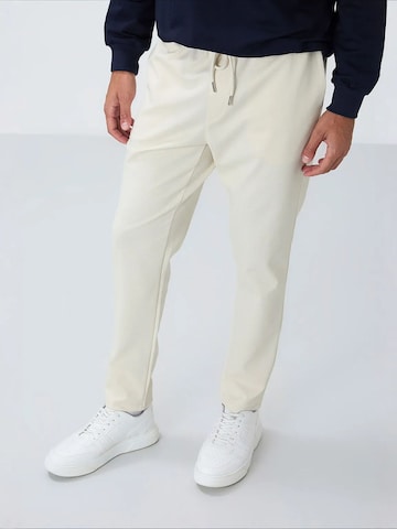 Tommy Life Tapered Workout Pants 'Jogginghose' in Beige
