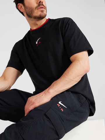 Effilé Pantalon cargo 'AIR' Nike Sportswear en noir