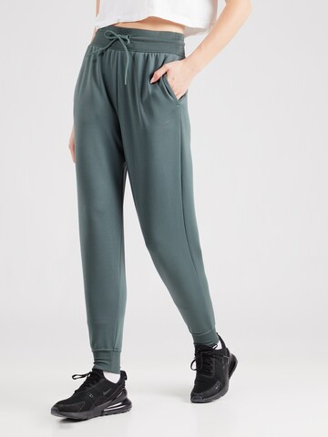 NIKE Tapered Sports trousers 'ONE' in Green: front