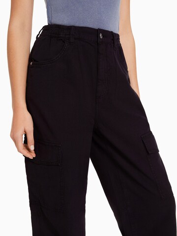 Bershka Tapered Cargobukser i sort