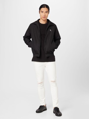Calvin Klein Jeans Φθινοπωρινό και ανοιξιάτικο μπουφάν 'Harrington' σε μαύρο