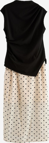 Next Mekko värissä musta: etupuoli