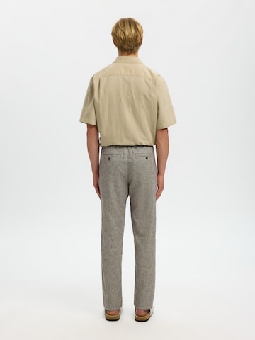 Slimfit Pantaloni eleganți 'SLHBRODY' de la SELECTED pe verde