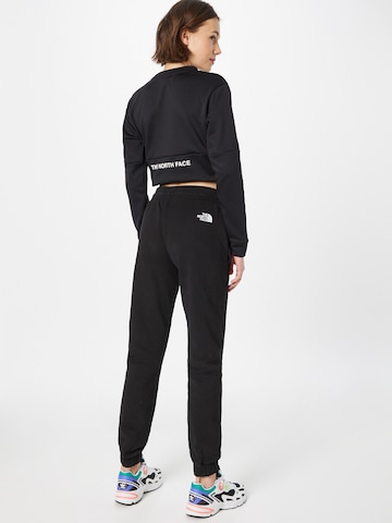 THE NORTH FACE Tapered Sportbroek in Zwart