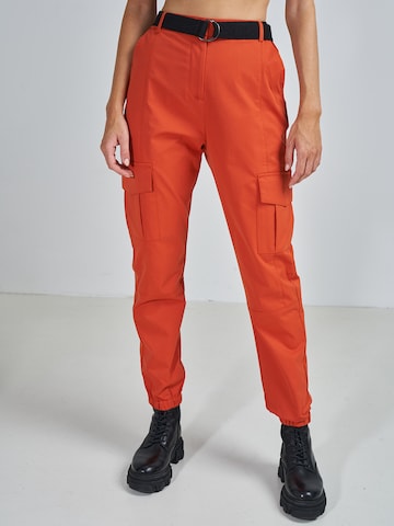 ABOUT YOU x Swalina&Linus Tapered Cargo Pants 'Mira' in Orange: front