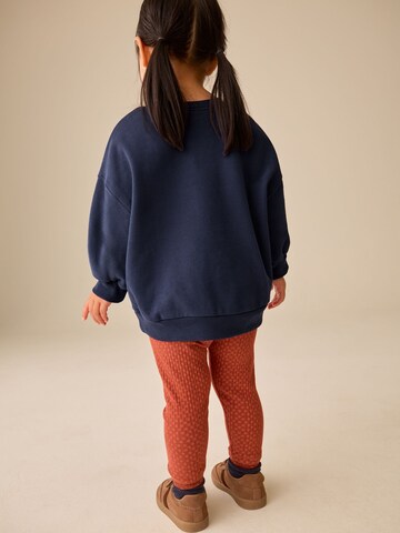Set Next en bleu