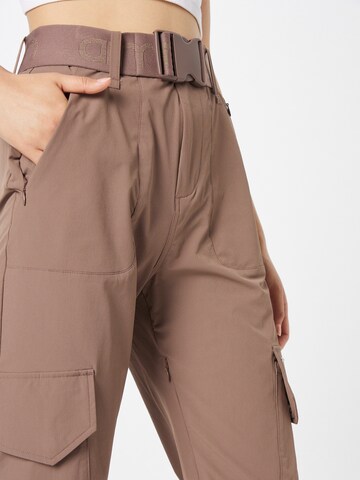 aim'n Tapered Sportbroek 'Macchiato' in Bruin