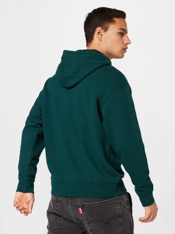 LEVI'S ® - Regular Fit Sweatshirt 'Relaxed Graphic Hoodie' em verde