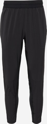 NIKE Tapered Sports trousers in Black: front