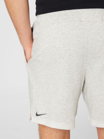 NIKE Regular Workout Pants in Grey