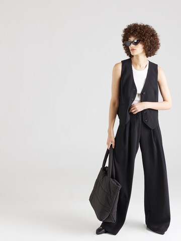 ABOUT YOU x Iconic by Tatiana Kucharova Loose fit Pleat-front trousers 'Mathilda' in Black