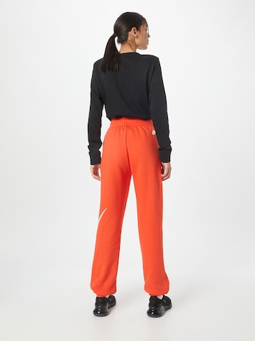 Nike Sportswear Tapered Trousers 'EMEA' in Red