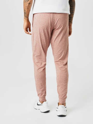 Effilé Pantalon de sport NIKE en rose