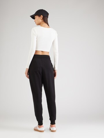 ABOUT YOU Tapered Trousers 'Teena' in Black