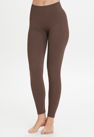 Athlecia Skinny Workout Pants 'Flow' in Brown: front