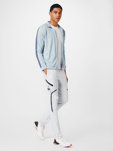 Regular Pantalon de sport 'UNSTOPPABLE' UNDER ARMOUR en gris