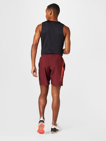 regular Pantaloni sportivi di UNDER ARMOUR in rosso