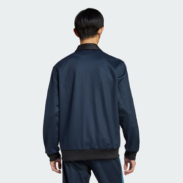 ADIDAS ORIGINALS - Chaqueta de entretiempo en azul